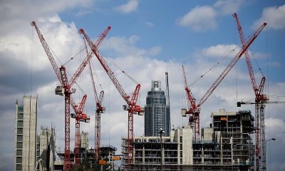 Construction cranes working on the Embassy Gardens luxury development in Battersea